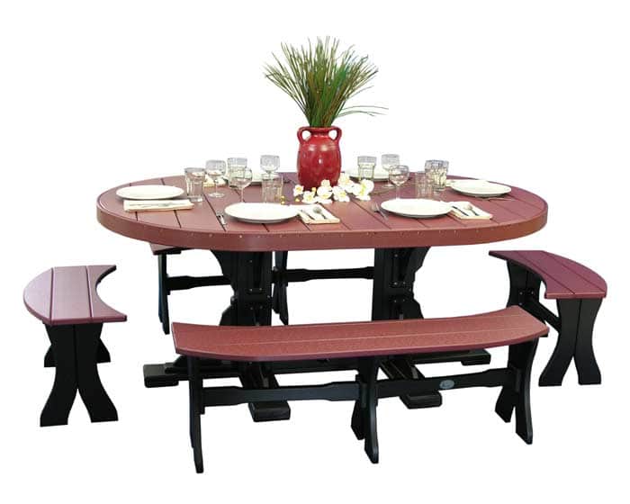 4x6 oval poly dining table set in cherrywood and black from Salem Structures, shown with matching curved benches and full dining place settings.